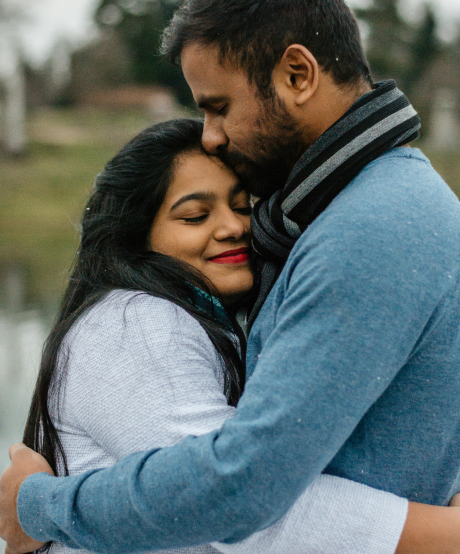 Couple hugging each other outside Couple hugging each other outside